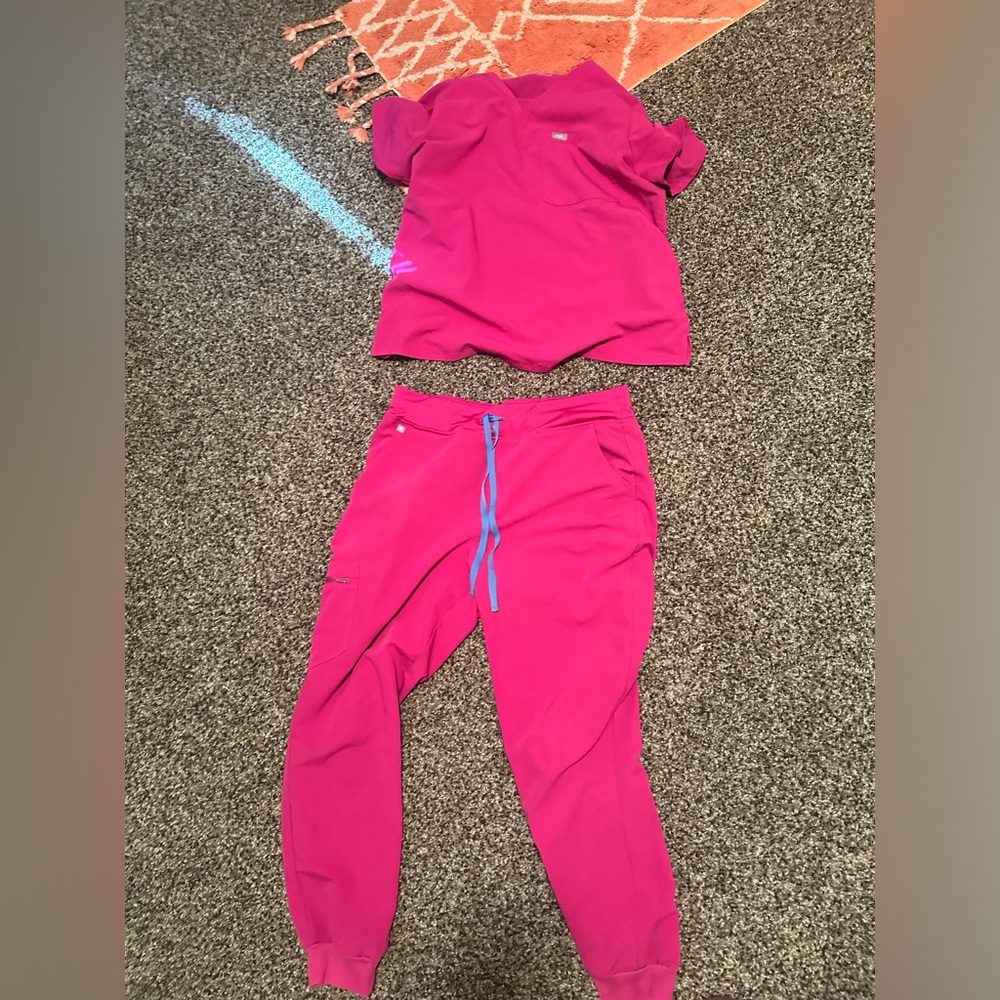 Figs scrubs set in raspberry. One pocket top and Zamora joggers